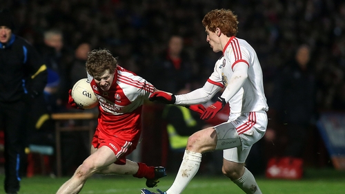 Derry's Enda Lynn tries to escape the attentions of Peter Harte