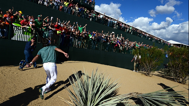 Bubba Watson throws souvenirs into the crowd