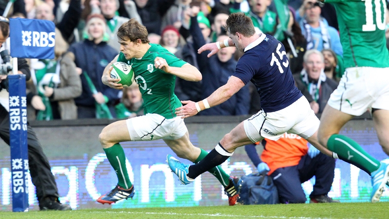 Andrew Trimble sprints past Scotland full back Stuart Hogg for Ireland's first try