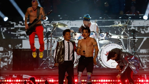 Flea (left) on stage with the Red Hot Chili Peppers