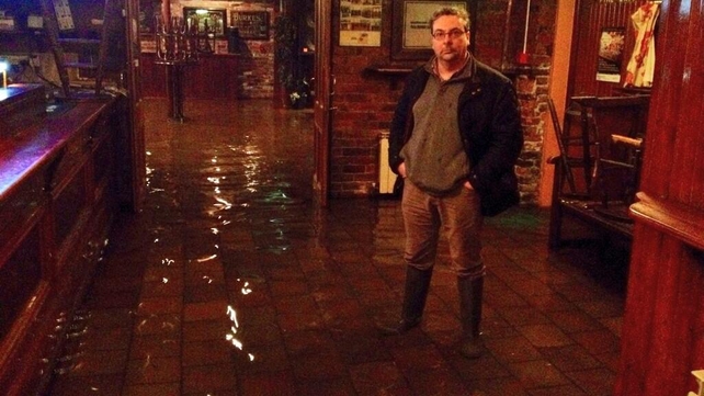 Joe Donnelly stands in a flooded Counihan's Bar