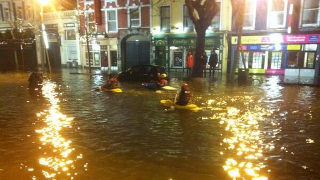 Kayakers travel along the Grand Parade