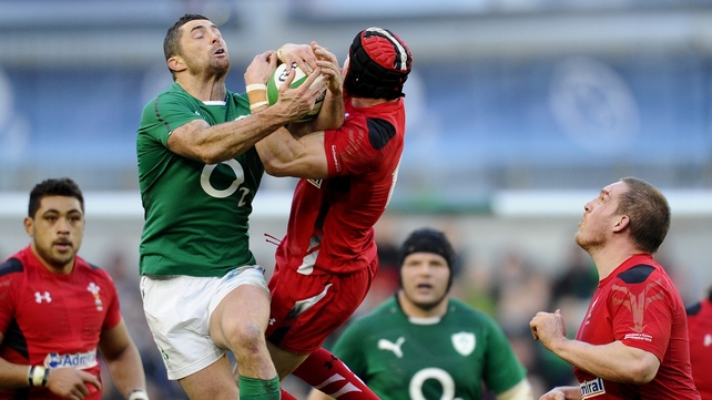 Full-backs fly: Rob Kearney and Leigh Halfpenny hang on for dear life