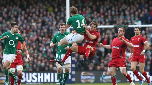 Hang-time: Andrew Trimble and Liam Williams leap for the ball