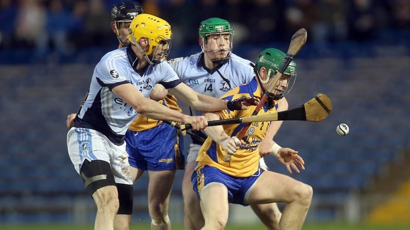 Conor O'Hare of Portumna with David Breen and Shane Dowling of Na Piarsaigh