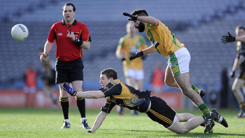 Fuerty’s Philip Neilan (black and yellow) and Aidan Casey of Two Mile House
