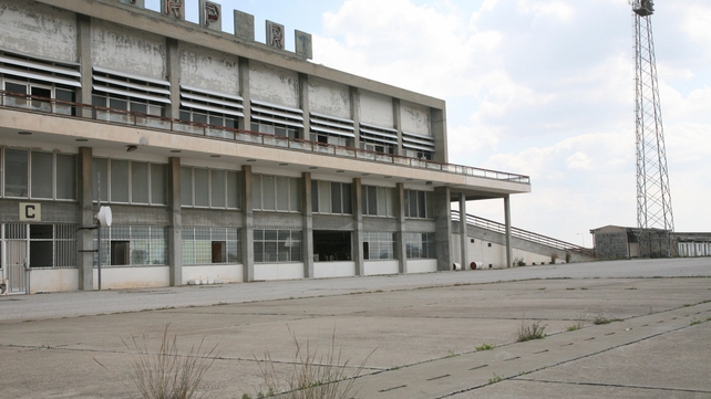 Weeds are coming up through the concrete in front of the terminal building