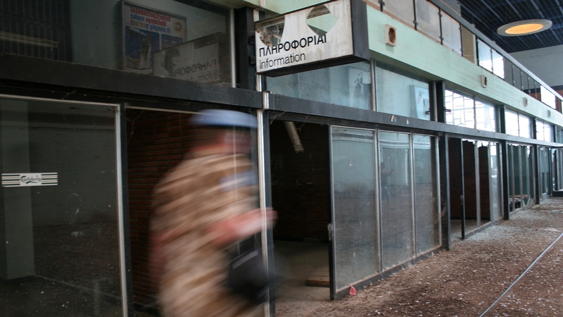 A UN soldier patrols the empty bulding