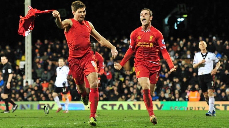 Steven Gerrard (l) celebrates his late winner against Fulham
