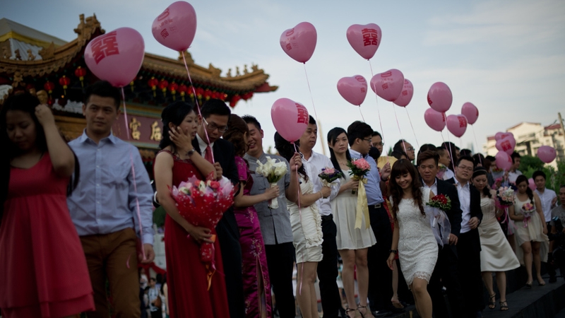 Couples celebrate after mass wedding ceremony