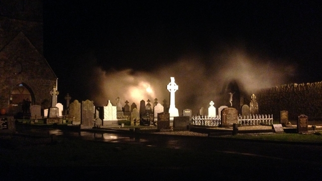 Waves crash against the wall of the Abbeyside churchyard in Co Waterford (Pic: Patrick Kenealy)