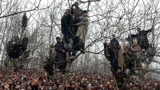 Kashmiri villagers shout pro-freedom slogans during the funeral of alleged Hizbul Mujahideen militant Arshid Ahmed in Shopian