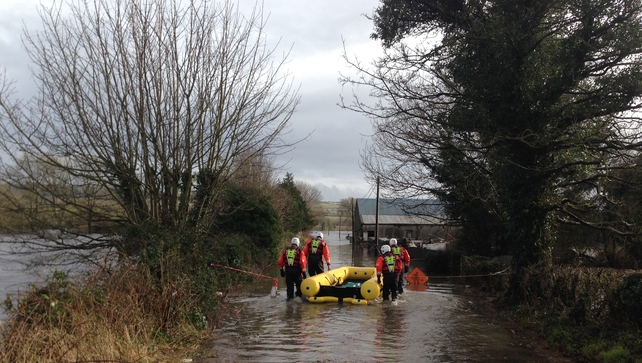 Fire service personnel from Loughrea carrying out a water rescue at Grannagh, near Peterswell, Co Galway