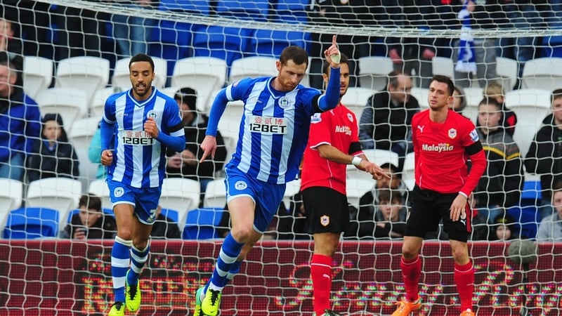Wigan's Chris McCann (centre) celebrates after scoring the opening goal