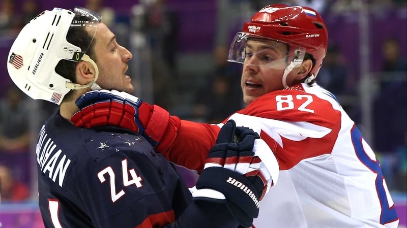 Evgeny Medvedev of Russia faces off with USA's Ryan Callahan