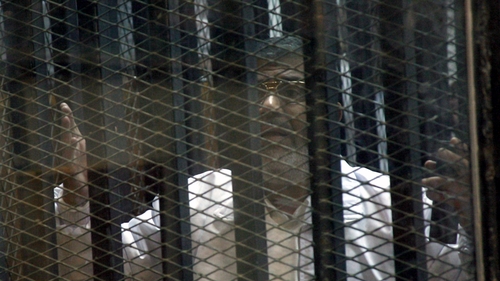 Mr Mursi's legal team protested they could not hear their client speak from inside a soundproof glass cage