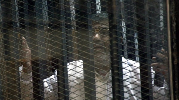 Mr Mursi's legal team protested they could not hear their client speak from inside a soundproof glass cage