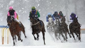 Eduardo Pedroza (L) on Zarras is on his way to win the Grand Prix Prestige on the frozen lake on the second weekend of the White Turf races in St Moritz in Switzerland.