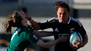 New Zealand player stiff arms Aoife Doyle of Ireland during the IRB Women's Sevens World Series in Georgia