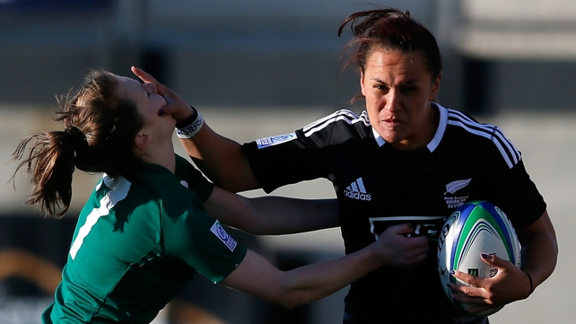 New Zealand player stiff arms Aoife Doyle of Ireland during the IRB Women's Sevens World Series in Georgia