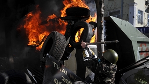 Protesters clash with police at a barricade (Pic: EPA)
