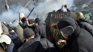 Protesters attack police officers with batons