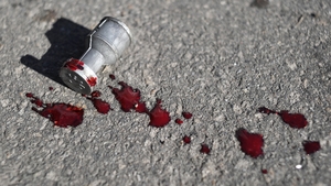 A bullet used by police lies stained with blood on the street (Pic: EPA)