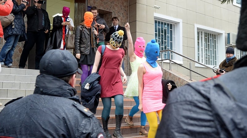 Pussy Riot members leave a police station near Sochi after being questioned about an alleged theft
