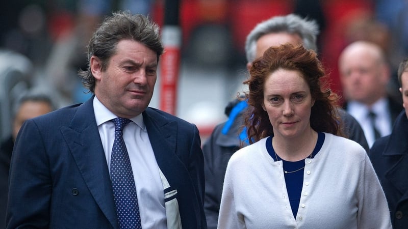 Rebekah Brooks (R), former News International chief executive, and her husband Charlie arrive for the phone-hacking trial at the Old Bailey