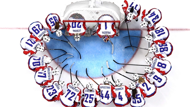 The Russian women's ice hockey team huddle before their tie with Switzerland at the Winter Olympics in Sochi