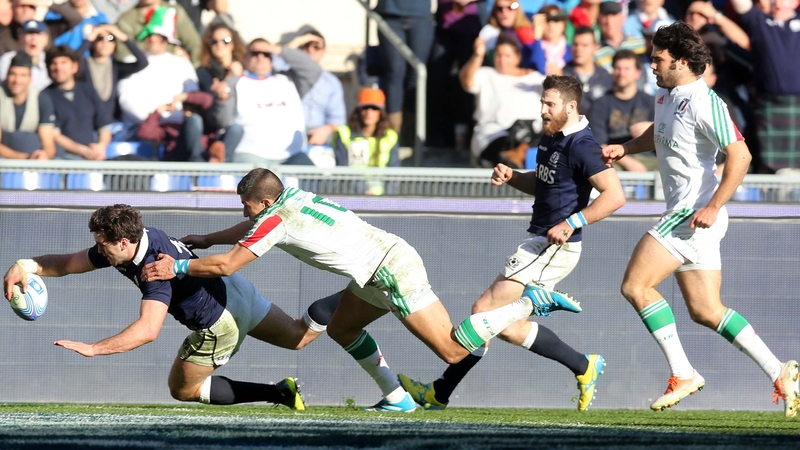 Alex Dunbar scores one of his two tries for Scotland