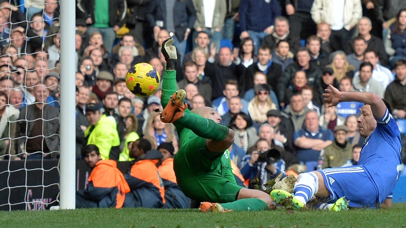 John Terry helps to bundle the ball home
