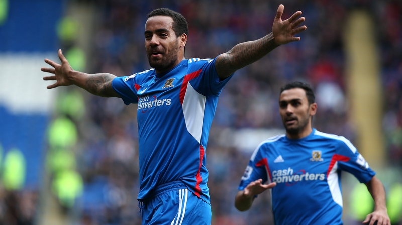 Tom Huddlestone celebrates scoring the game's opening goal