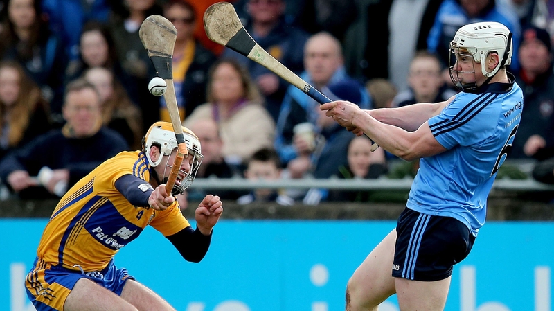 Conor McGrath of Clare tries to block Liam Rushe's clearance at Parnell Park