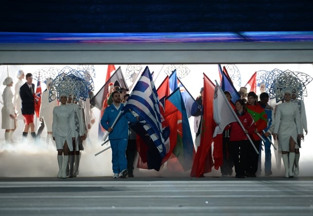 Flag-bearers enter stadium as the ceremony begins