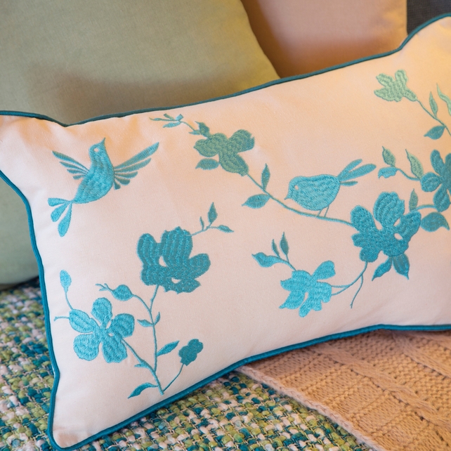 Bird embroidered cushion €8, 2pk plain dye cushion cover green biscuit €4.90, Cable knit throw €25, knitted spring throw €20