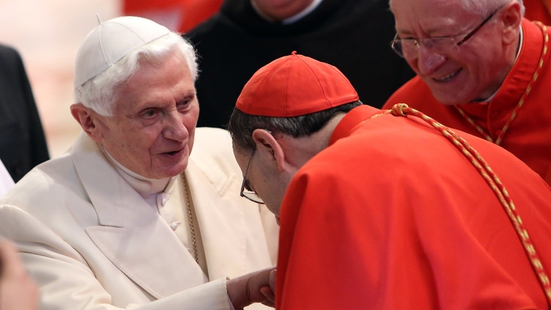 Pope Emeritus Benedict greets cardinals as he leaves St Peter's Basilica at the end of the Consistory at the weekend
