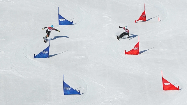 Alexander Bergmann of Germany and Aaron March of Italy compete in the Snowboard Men's Parallel Slalom