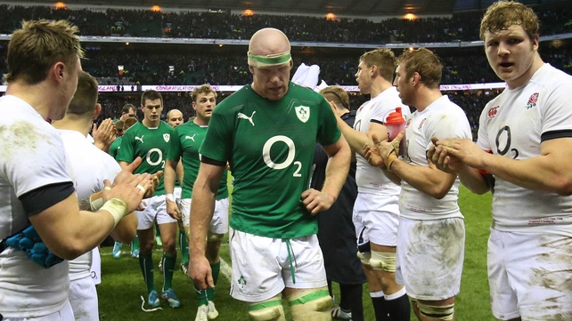 Captain Paul O'Connell leads a dejected Ireland off the pitch after defeat at Twickenham