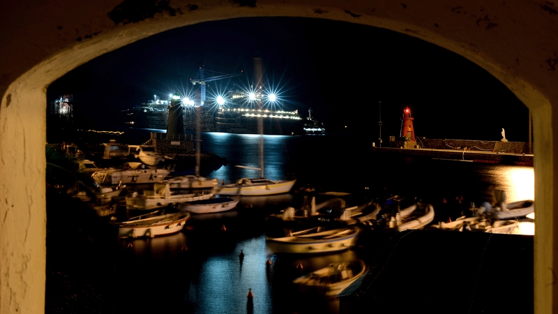 The wreckage of the Costa Concordia is seen in the harbour of Giglio Porto