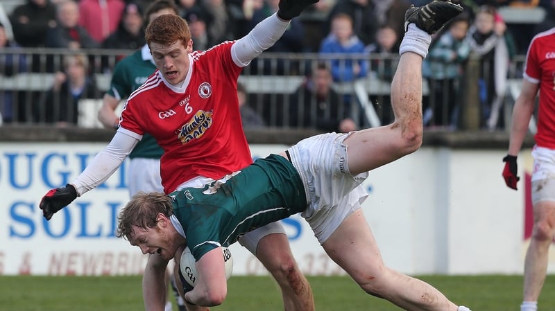Kildare's Tomas O'Connor tackled by Peter Harte in Newbridge