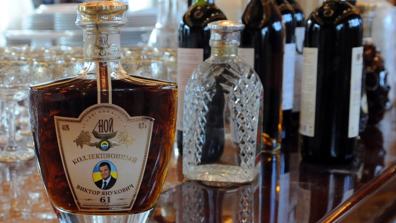 A bottle of brandy features an image of the ousted president