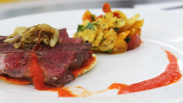 Seared ribeye of beef with red pepper tomatillo pu