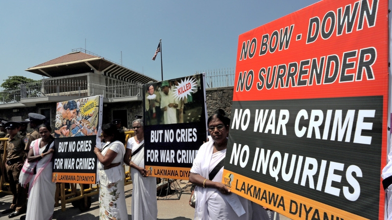 Pro-government activists marched towards US Embassy in Colombo where they shouted slogans against proposed war crimes investigation (Pic: EPA)