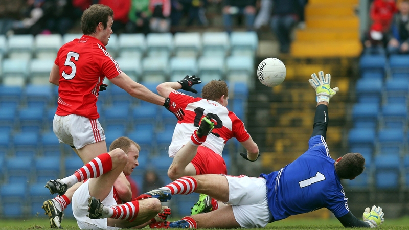 Cork's James Loughrey, Michael Shields and Ken O'Halloran deny Enda Lynn of Derry a goal chance