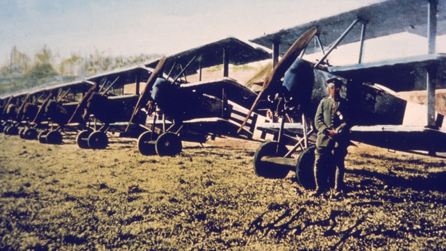A German soldier stands near a row of Fokker DR-1s. The DR-1 was designed by aircraft manufacturer Anthony Fokker, known as the 'Flying Dutchman,' and was the plane used by the famous Red Baron