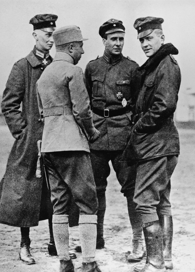 Baron Manfred von Richthofen (1892 - 1918), right, talks to other German officers, 191Os. Von Richthofen, known as the Red Baron, is considered the most successful fighter pilot of all time, racking up 80 air combat battles in less than two years