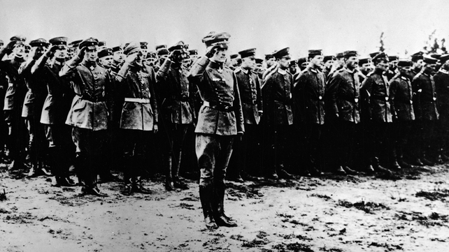 The Red Baron salutes in front of the officers and staff of Fighting Squadron No 11
