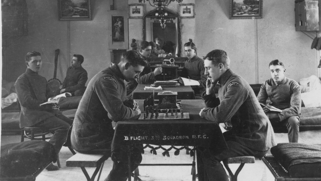 British pilots of B flight, 3 Squadron RFC, relaxing in the mess at Larkhill in Wiltshire, awaiting a call to action. (From left to right) Carroll, Turner, Martin, Dibble, Newby, Aylen and Webb)