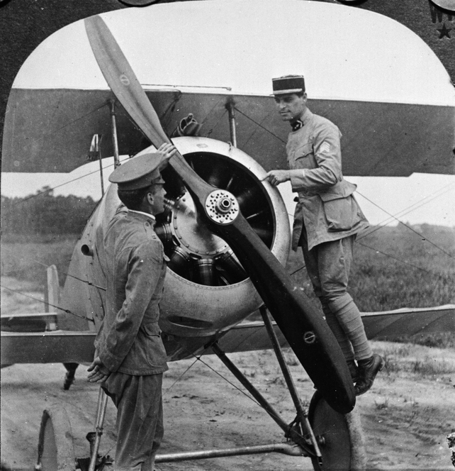 Lt. Le Maitre of the French Aviation Forces in America explains the mechanism of a Nieuport biplane to an American pilot, Fort Monroe, Virginia, 1910s